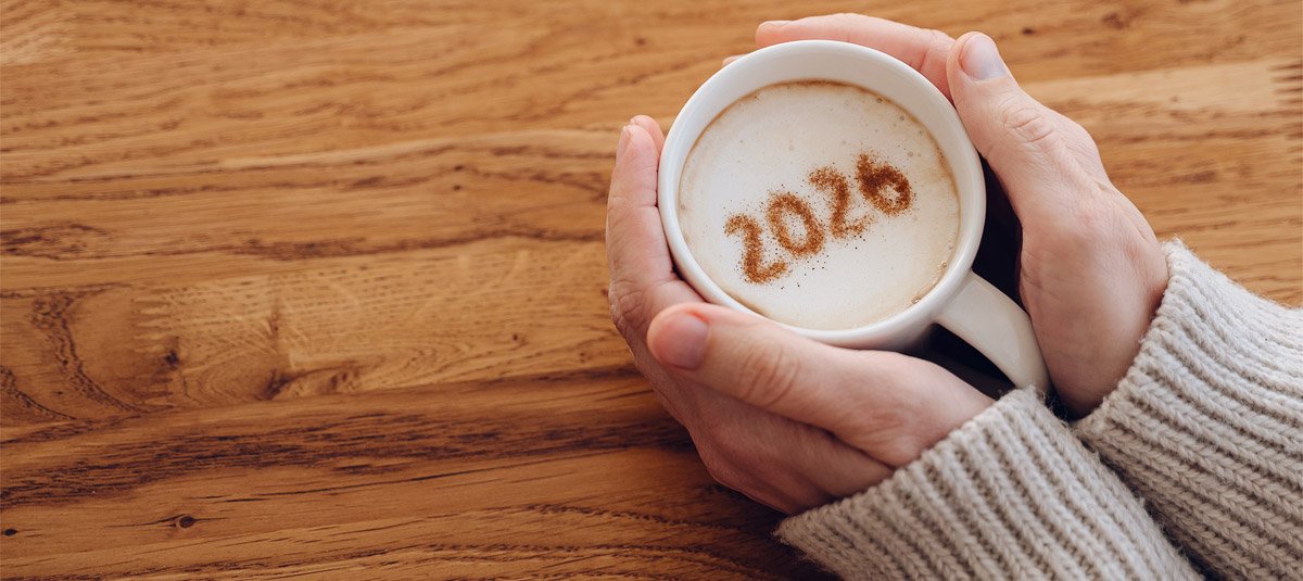 woman-in-warm-sweater-enjoying-coffee-with-2026-on-foam